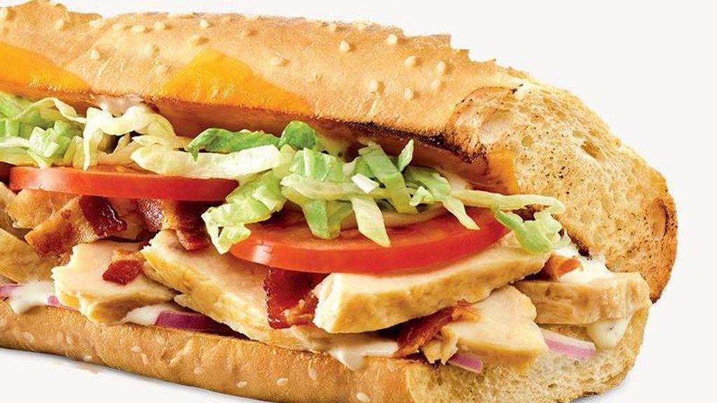 Mesquite Chicken Sub · Oven roasted chicken breast strips, bacon, cheddar cheese, tomato, red onion, shredded lettuce, and ranch dressing.