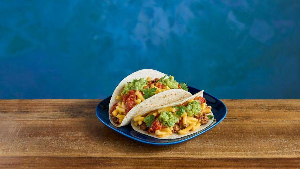 Kraft®Mac & Cheese Tacos · KRAFT Mac & Cheese inside two flour tortillas, topped with taco seasoned ground beef, salsa, guacamole and cilantro