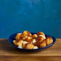 Poutine Kraft® Mac & Cheese Bites · KRAFT Mac & Cheese Bites topped with cheese curds and beef gravy