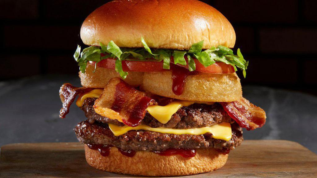 Bbq Bacon Tribeca Burger · Two, 4 oz fresh Angus beef patties, BBQ sauce, onion rings, bacon, lettuce, tomato, and American cheese.