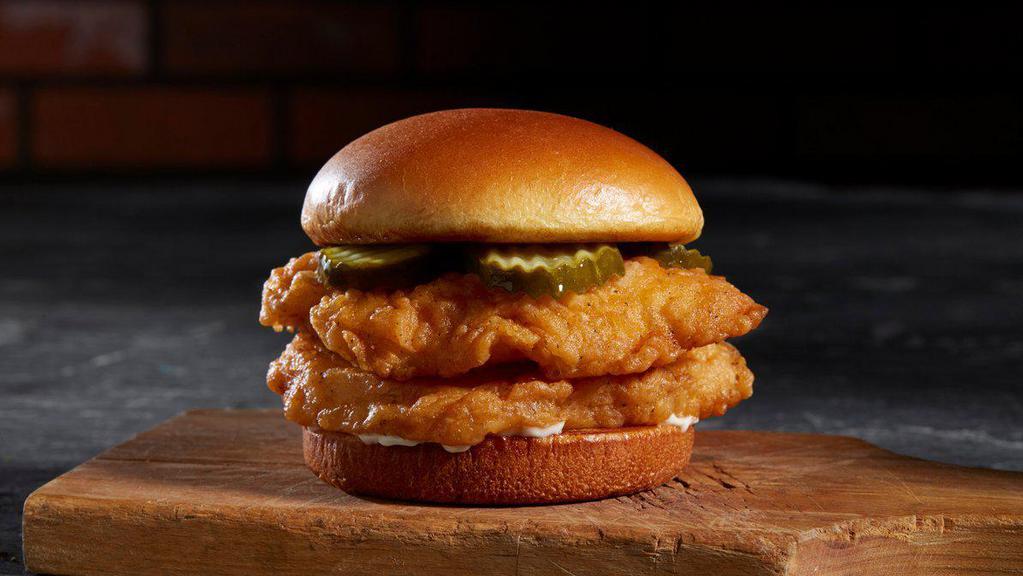 Southern Chicken Sandwich · Two, 4 oz deep-fried chicken breasts, crunchy pickle chips, and mayonnaise on a potato brioche bun.