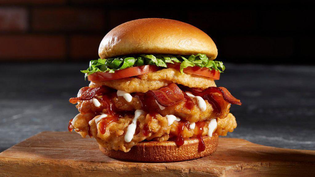 Bbq Bacon Tribeca · Two, 4 oz deep-fried chicken breast, BBQ sauce, onion rings, bacon, lettuce, and tomato.