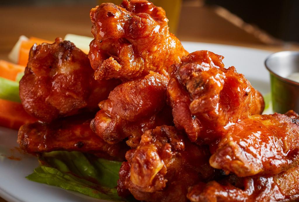 Spicy Wings · Chicken wings tossed in a homemade Hot sauce served with side of gorgonzola cheese dressing.