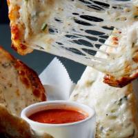 Garlic Bread With Cheese · Rustic Italian bread toasted with garlic parmesan butter and mozzarella cheese and served wi...