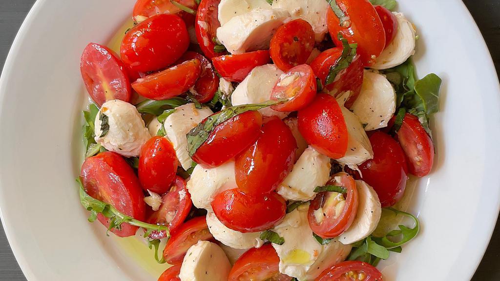Tomato & Mozzarella · Fresh mozzarella, tomatoes, olive oil, and basil.