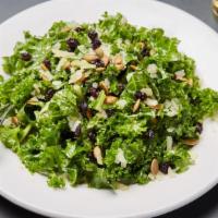 Kale Manchego Salad · kale, manchego cheese, dried currants, and roasted pumpkin seeds tossed in a sweet and spicy...