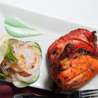 Tandoori Chicken · Spring chicken marinated in yogurt, garlic, ginger, lemon and fresh ground spices overnight ...