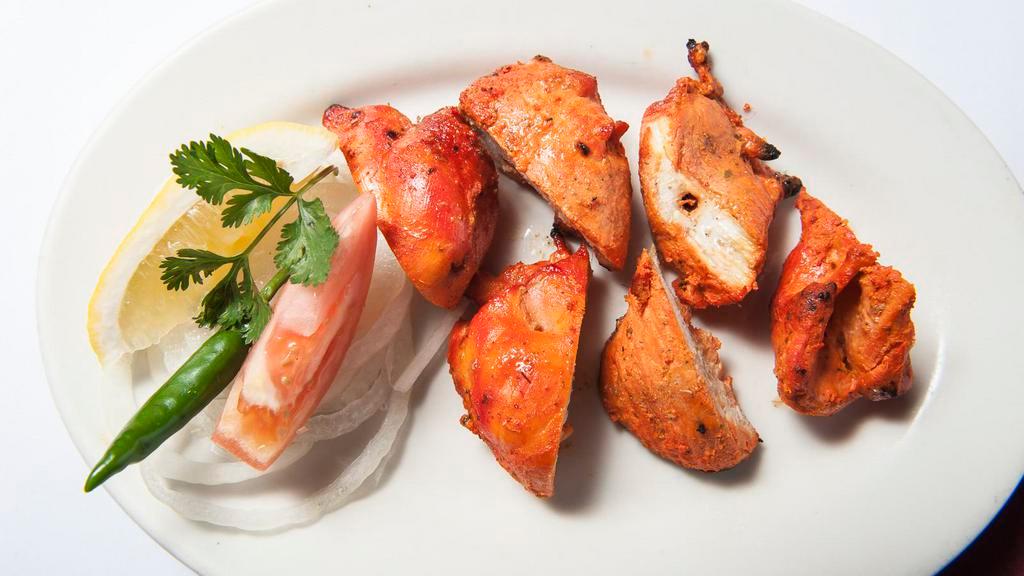 Chicken Tikka · Boneless chicken cubes marinated in spices and roasted in the tandoor.