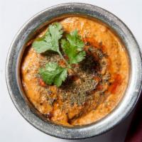Chicken Tikka Masala · Chicken breast cubes cooked in tandoor and simmered in a creamy tomato gravy with a succulen...
