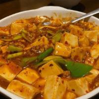 Age Tofu · Deep fried bean curd served with savory sauce.
