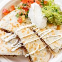Spinach Quesadilla · Sauteed in olive oil, fresh garlic, and onion.