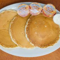 Pancakes · Stack of Three Pancakes- Buttermilk, Whole Wheat or Pumpkin

Served with Syrup & Butter