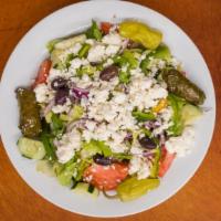 Greek Salad · Fresh Greens, Feta Cheese, Grape Leaves & Mediterranean Garnish

Served with House-made Gree...
