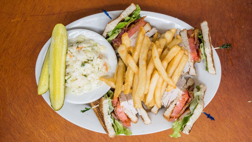 Turkey Club · Triple Decker Sandwich on White Toast with Lettuce, Tomato, Bacon & Mayo

Served with Fries