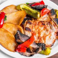 Pork Chops Contadina · With sliced potatoes, mushrooms and peppers.