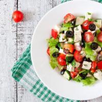 Chicken Greek Salad · Fresh romaine, grilled chicken, cucumbers, olives, onion, feta cheese, cherry tomatoes toppe...