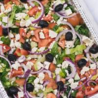 Greek Salad · Fresh romaine, cucumbers, olives, onion, feta cheese, cherry tomatoes topped with greek vina...