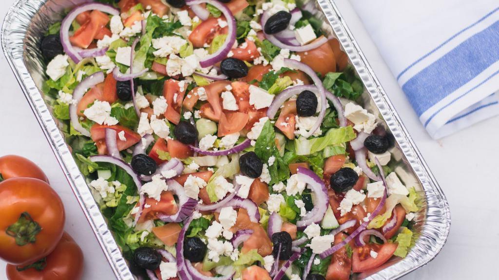 Greek Salad · Fresh Spring Mix, Feta, Banana Peppers, Kalamata Olives, Cherry Tomatoes, Cucumber, with Greek Dressing.