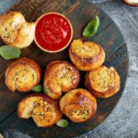 Garlic Knots · Delicious and soft knots tossed with garlic seasoning.