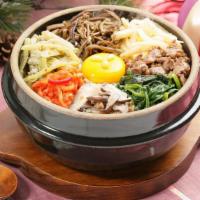Bibimbap · Rice bowl with mixed vegetables and hot pepper paste.