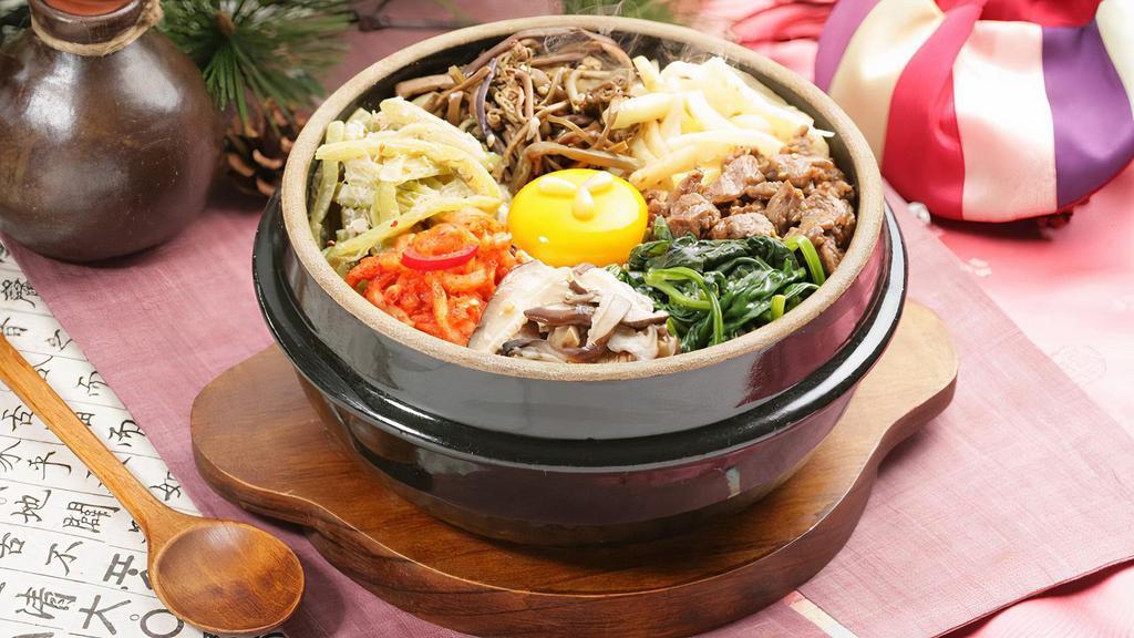 Bibimbap · Rice bowl with mixed vegetables and hot pepper paste.
