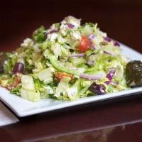 Greek Salad · Romaine Hearts, Cucumbers, Cherry Tomato, Olives, Feta and Lemon Dressing.