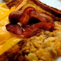 Loaded Times Square Breakfast · Served w/ Eggs your way, Bacon, Ham, Sausage & Homefries.