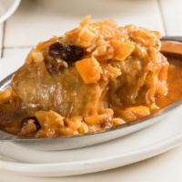 Stuffed Cabbage · Ground beef with rice wrapped in cabbage leaf and served in a sweet and sour sauce.