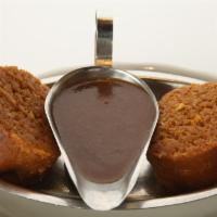 Stuffed Derma (Kishke)
 · Casing stuffed with matzoh meal, schmaltz, spices and beef. Served with gravy.