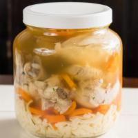 Chicken In The Pot · A traditional favorite: 1/2 a boiled chicken with noodles, carrots and matzoh ball soup.