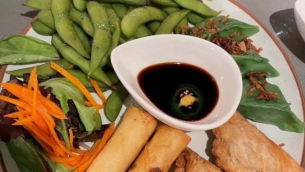Plum Platters · 2 chicken spring rolls, 2 vegetables curry puff, 3 vegetables steam dumplings and a portion of steamed organic edamame with sea salt. Served with nuc charm and sweet soy vinaigrette