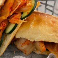 Banh Mi: Spicy Chicken Curry · Vietnamese sandwich on a toasted French baguette with pickled carrot, cucumber, and cilantro...