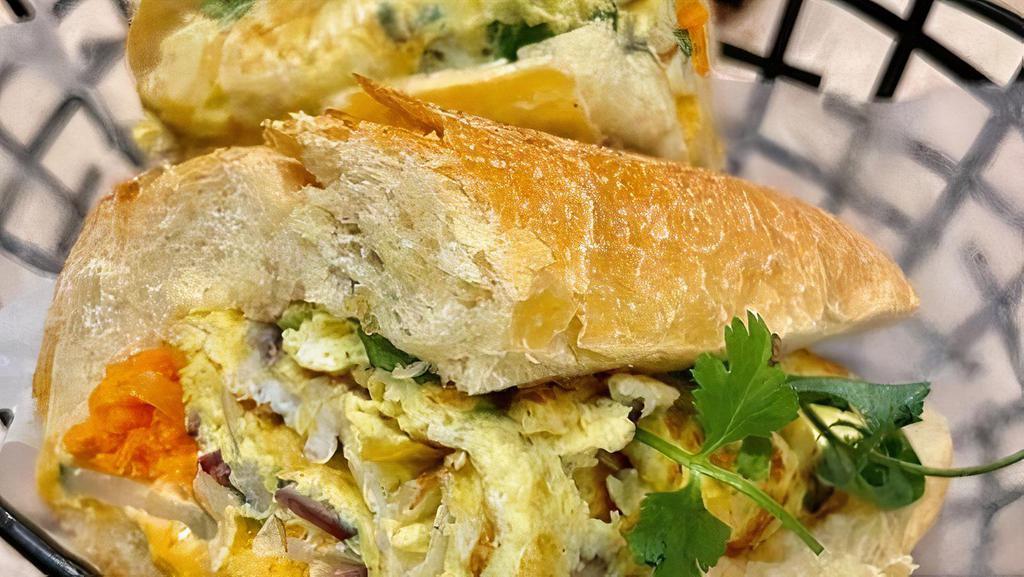 Banh Mi: Onion Omeltte · Omelette with onion, shallots and scallions Vietnamese sandwich on toasted French baguette with pickled carrot, cucumber, cilantro and spicy mayonnaise.