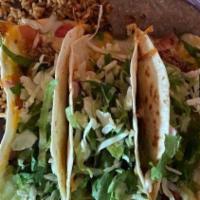 Classic A La Carte Taco · Choice of one of our chicken, pork, brisket, ground beef, veggie, or fish taco. Lettuce, che...