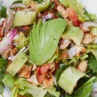 Asian Sesame Ginger Salad · Pick protein, romaine, spinach, tomatoes, cucumbers, red onions, sesame seeds, craisins, avo...