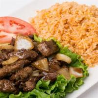 Our Signature Shaken Beef Cubes With Fried Rice · diced flank steak sautéed with onions and French butter and tomato fried rice and egg