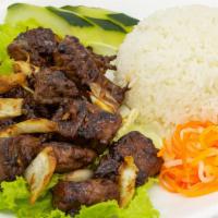 Our Signature Shaken Beef Cubes With Rice · diced flank steak sautéed with onions and French butter and white rice