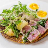 Salade Nicoise Socca · Chickpea flatbread, rare tuna, olive aioli petite salade and soft boiled egg.

**eating raw ...