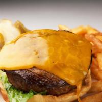 Moo-Shroom Burger · Cheeseburger topped with crispy portobello mushrooms. Served with an order of fries