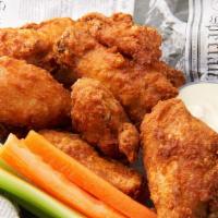 Chicken Wings · Served with blue cheese dressing, celery, and carrots.
