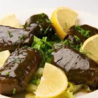 Stuffed Grape Leaves · Filled with rice and herbs.