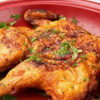 Chicken Tabaka · Pan-roasted organic baby chicken in a rich garlic-herb broth served with warm Uzbek bread an...