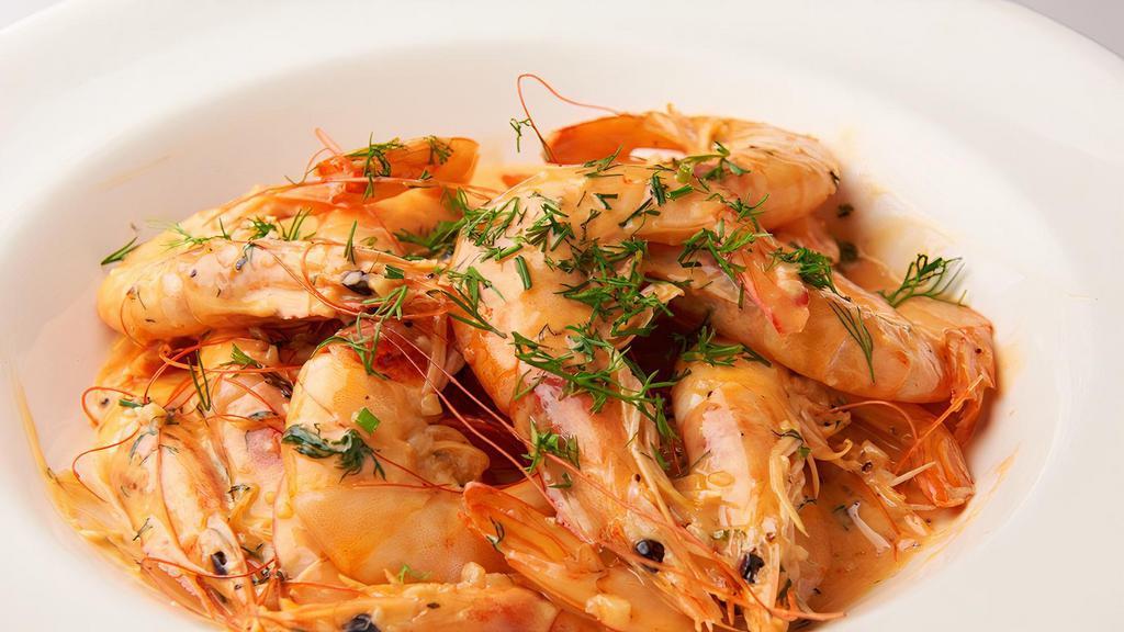 Shrimp Sautéed · 20 piece head-on shrimp in garlic white wine sauce.