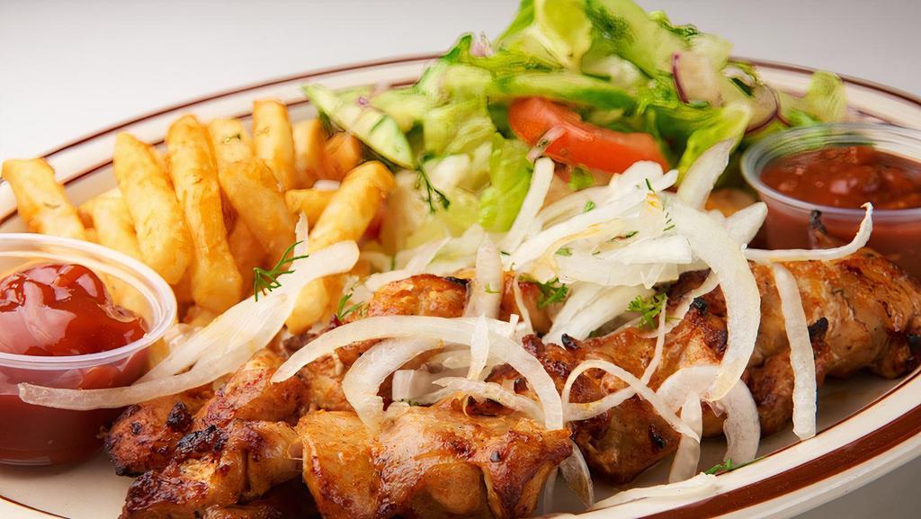 Chicken Kebabs Platter · Two chicken kebabs served with salad and fries or rice pilaf.