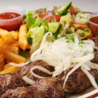 Lulya Kebabs Platter · Two ground lamb kebabs cooked to your preferred temperature served with salad and fries or r...