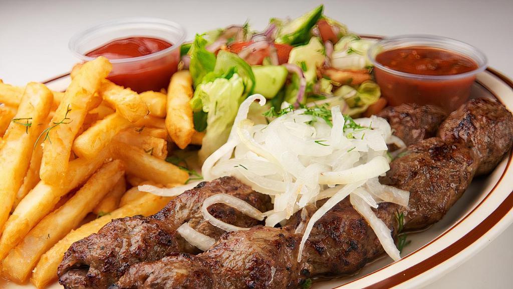 Lulya Kebabs Platter · Two ground lamb kebabs cooked to your preferred temperature served with salad and fries or rice pilaf.