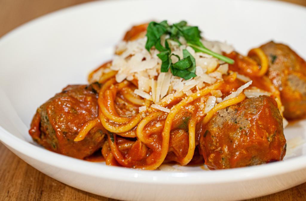 Spaghetti Polpette · Homemade veal meatballs in tomato sauce.