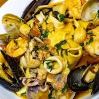 Pappardelle Di Mare · Mixed seafood (mussels, clams, shrimp, calamari, baby scallops) in a garlic, white wine toma...