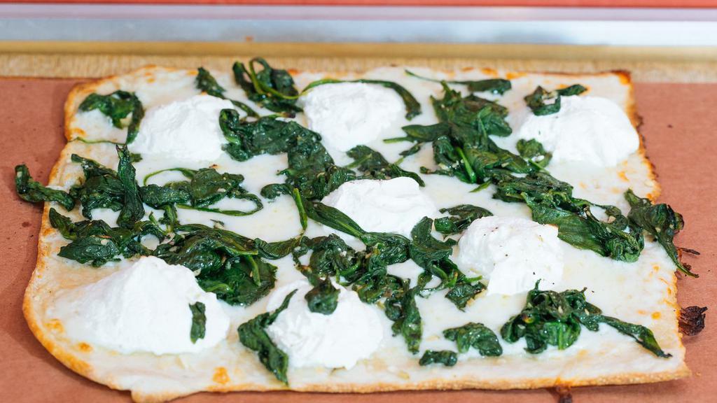 Spinach Pie  · Sauteed spinach with garlic, ricotta, and mozzarella.