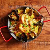 Valencian Risotto · Shrimp, Calamari, Clams, Mussels, Chorizo, Chicken, Red Pepper, Peas, Spanish Saffron